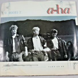 Take On Me /Love Is Reason - 1985 • Sencillo/EP