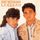 Portada de la canción "É o Amor", de Zezé Di Camargo & Luciano
