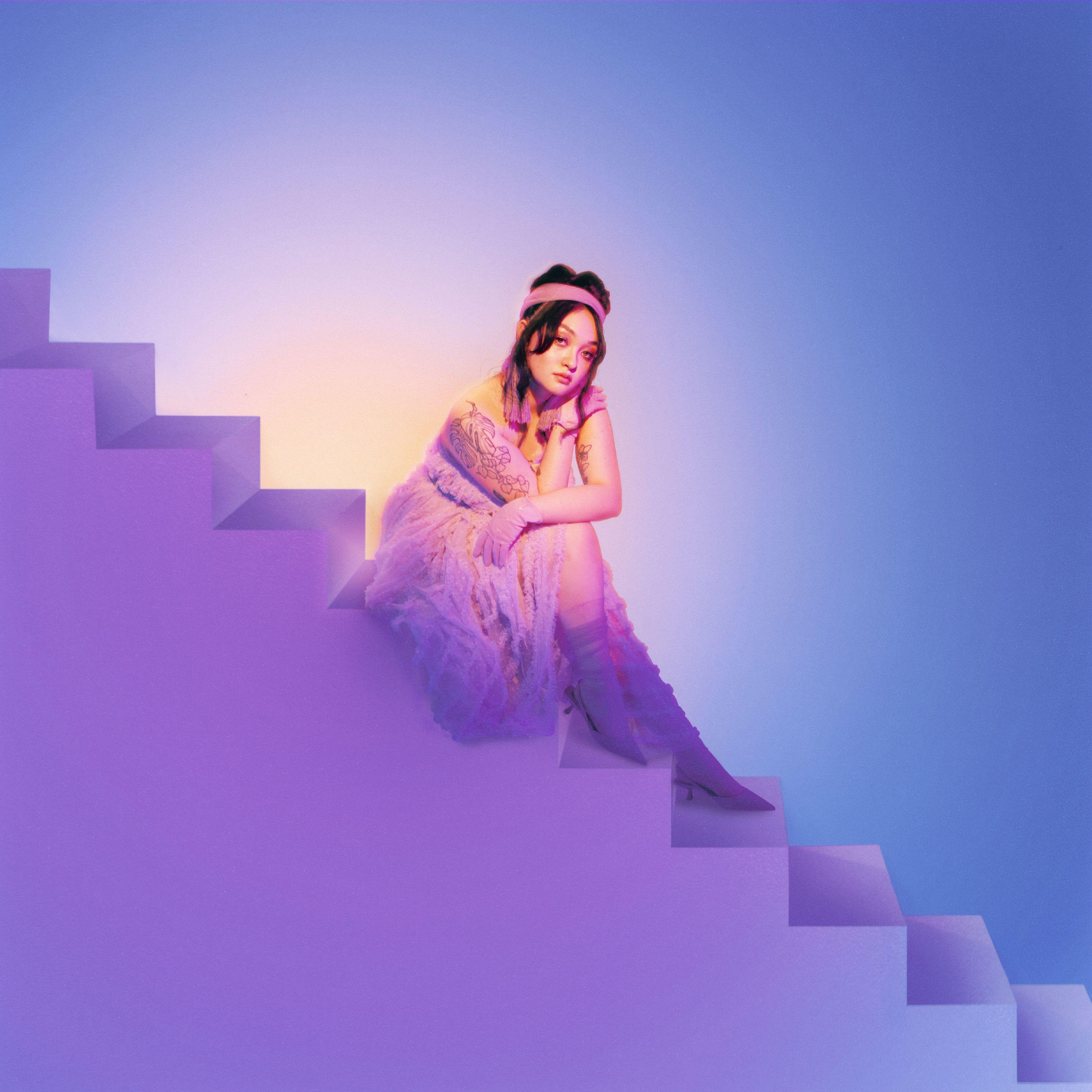 Album cover of "rising" by mxmtoon