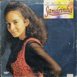 Capa do álbum "Ágape (Relançamento)", de Sandrinha