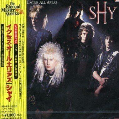 Portada de Álbum "Excess All Areas", de Shy