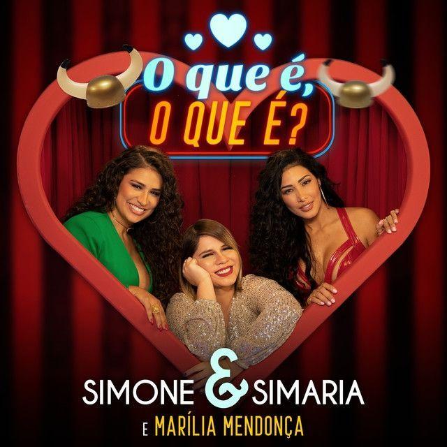 Capa do álbum "O Que É O Que É? (part. Simone e Simaria)", de Marília Mendonça