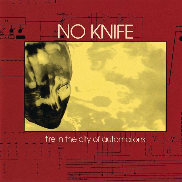Capa do Álbum "Fire In The City Of Automatons ", de No Knife