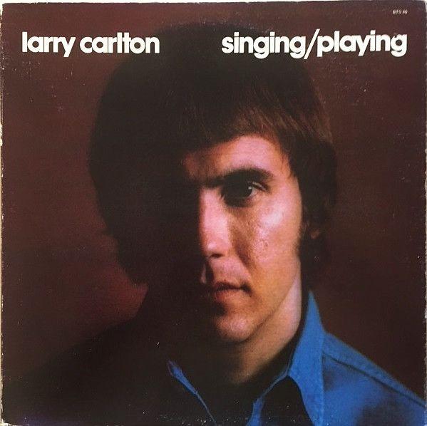 Album cover of "Singing / Playing" by Larry Carlton